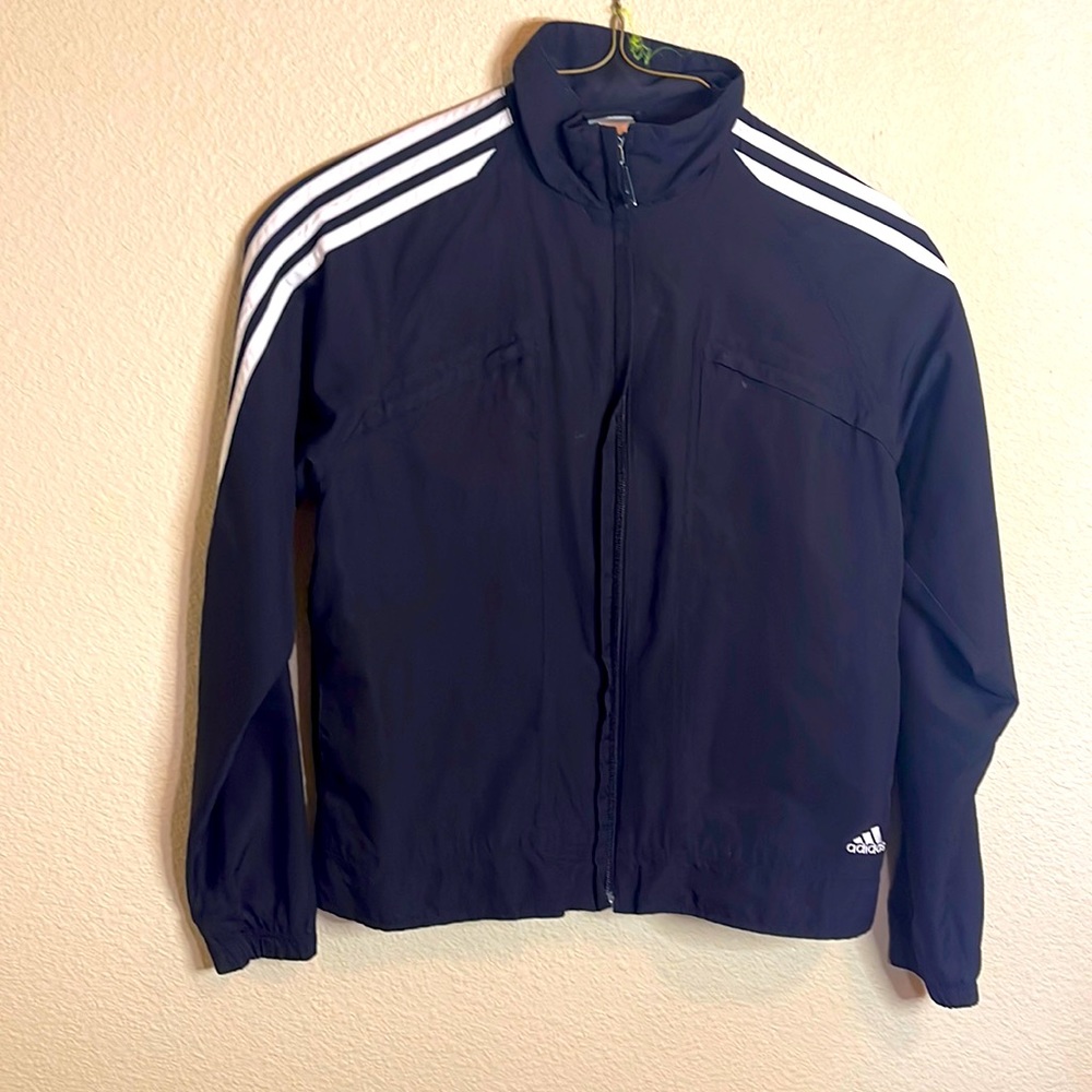 Adidas women’s windbreaker size M black with white trim.